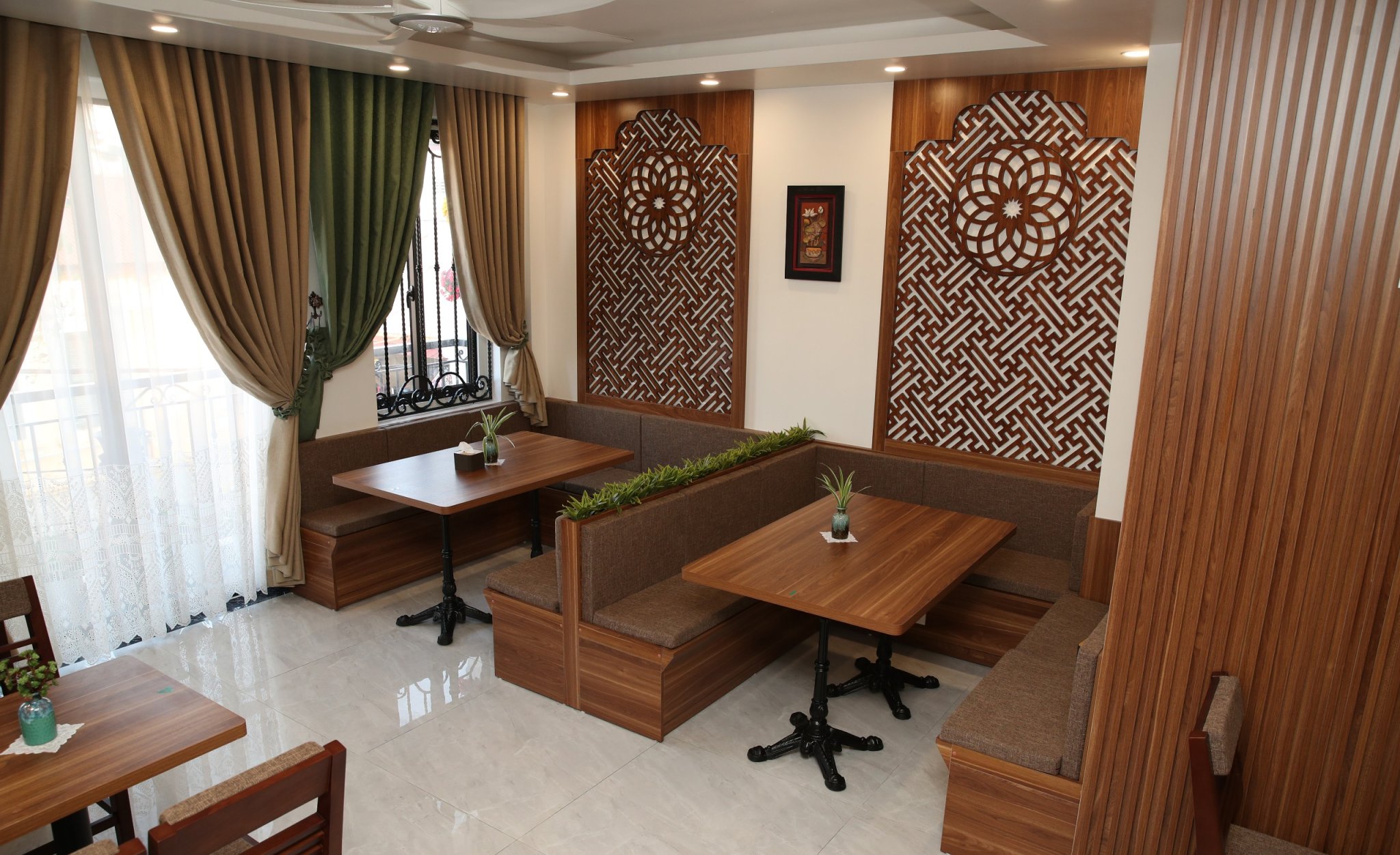 Wooden tables and dining booths at KP