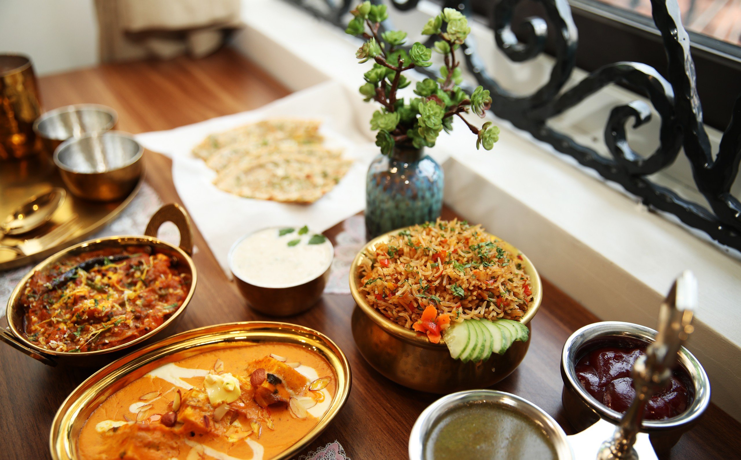 Colourful Indian vegetarian curries, rice and breads photographed at KP