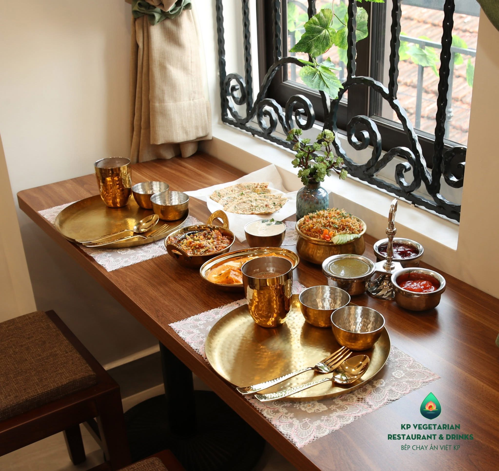 An original KP meal on a wooden table beside the window
